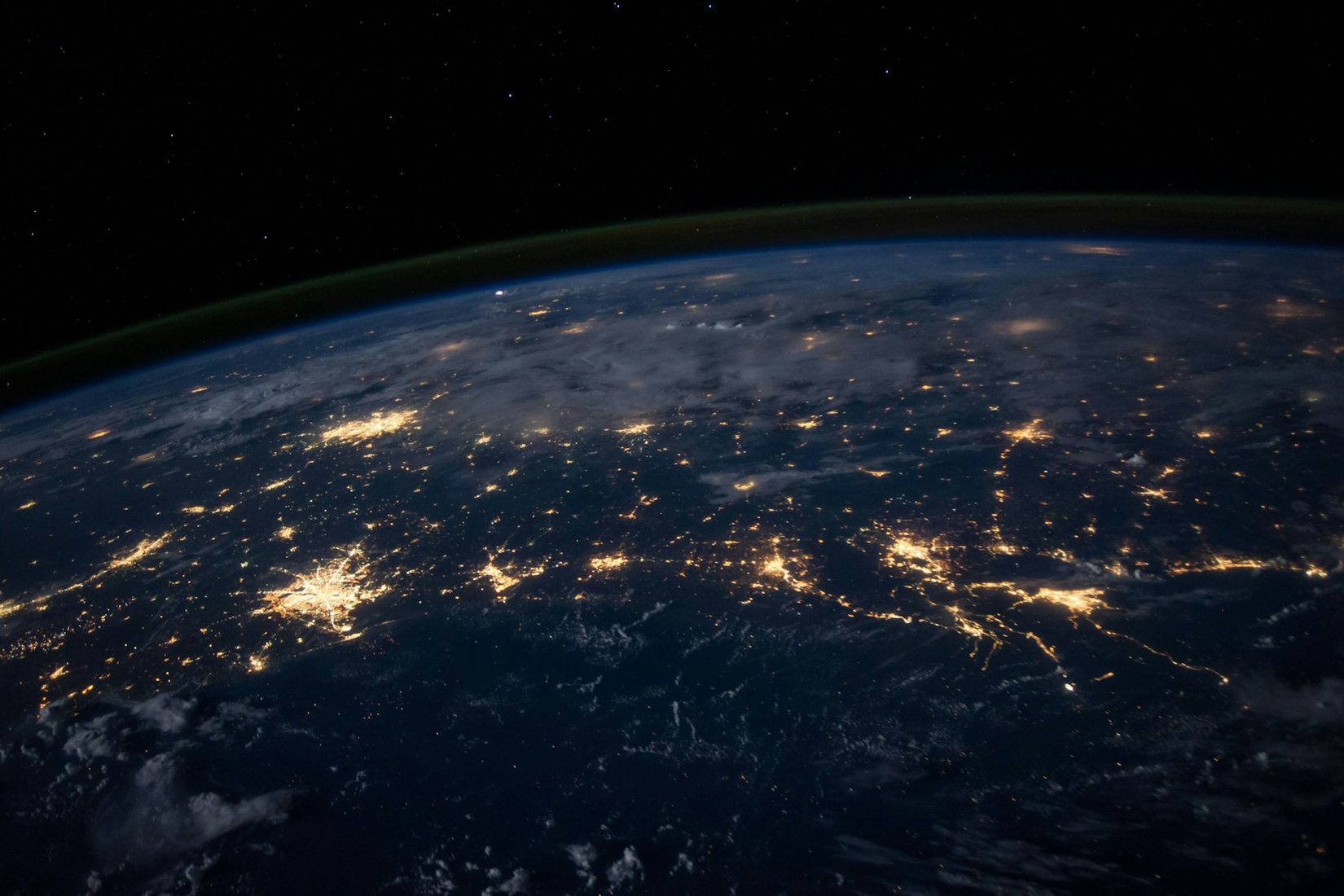 North America at night from orbit, cities and the networks between them lit